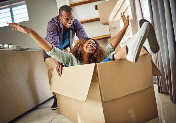 Couple playing with a moving box